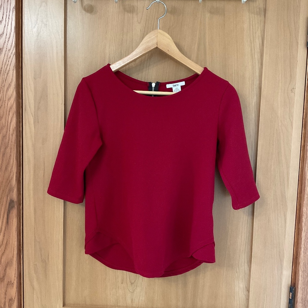 Red blouse with 3/4 length sleeve. Size S.